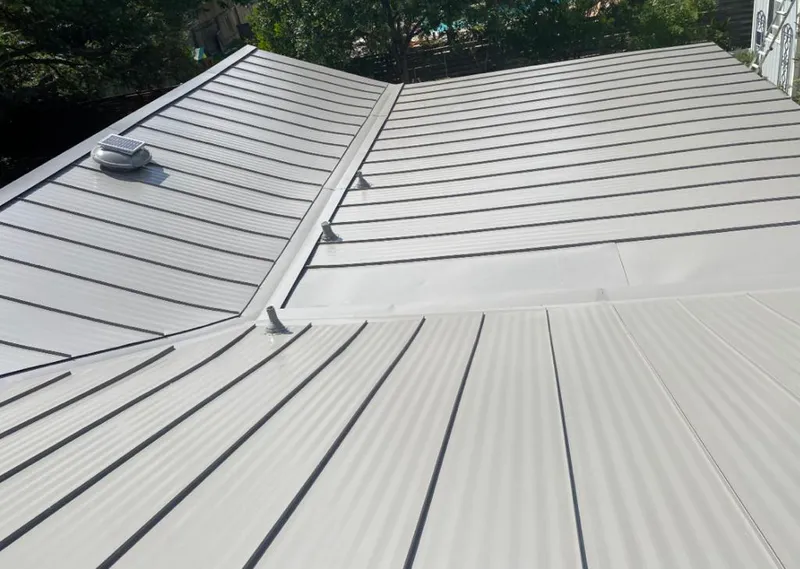 Solar attic fan installed on a metal roof for Roof Ventilation in Brainerd